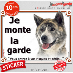 Akita Inu Japonais bringé, panneau autocollant "Je Monte la Garde, risques périls" portail entrée, sticker adhésif photo