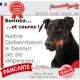 Pancarte portail Attention au Chien humour "Sonnez et courez, notre Dobermann noir et feu a besoin de se dépenser" photo